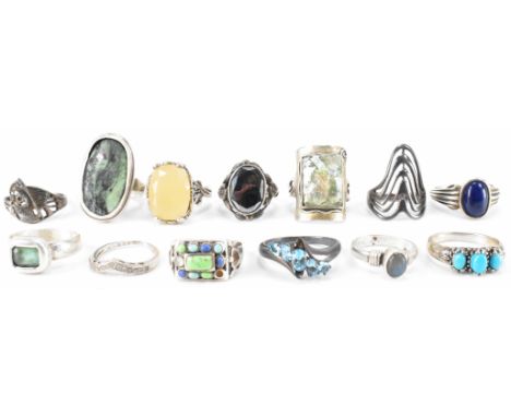 A group of thirteen silver rings. The lot to include a selection of silver stone set dress rings with examples possibly inclu