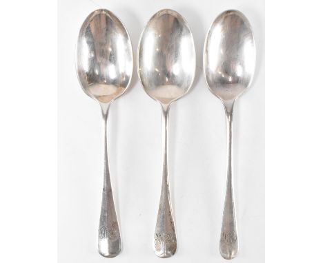 A group of three silver hallmarked spoons. The spoons having rounded terminals with engraved initials. The lot to include Elk