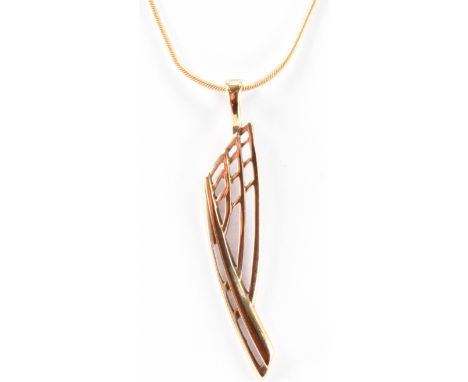 A gold pendant necklace having a modernist style pendant held upon as snake chain. Both chain and pendant marked 375. Pendant