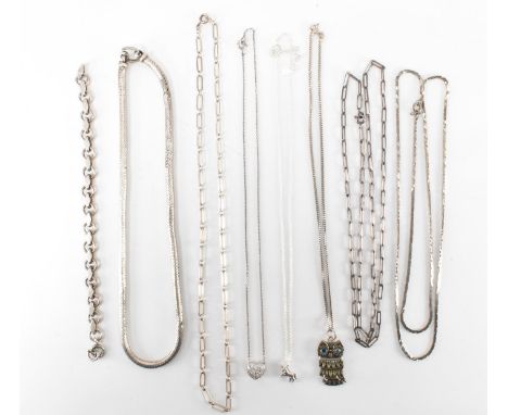 An assortment of marked and unmarked silver chain necklaces to include a thick snake chain necklace, a curb chain bracelet, a