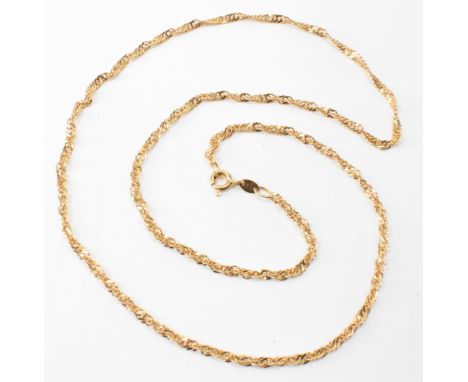 A gold rope twist necklace chain. The necklace having fine rope twist flat links. Marked 585 to the jump link and 14k to the 