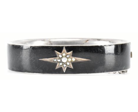 A Victorian 19th century black enamel and silver mourning bracelet. The bracelet being set with a series of seed pearls in a 