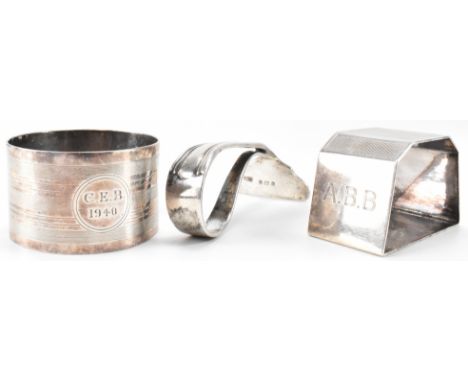 Two silver hallmarked napkin rings and a spoons pusher. The lot to include an initial panel napkin ring (hallmarked Birmingha