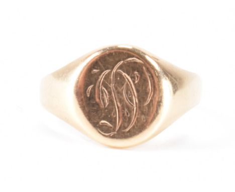 A vintage gold signet ring having a round head with engraved letter D. Marked 10k to the back of the head. Weight 1.9g. Size 