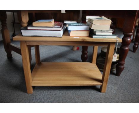 A light oak two tier occasional table