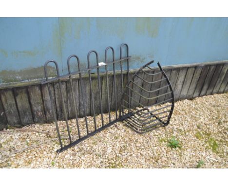 A single section of iron railing and a manger