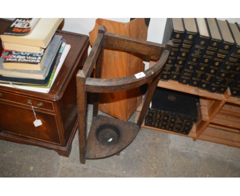 An oak corner stick stand and a stripped pine hanging corner shelf unit