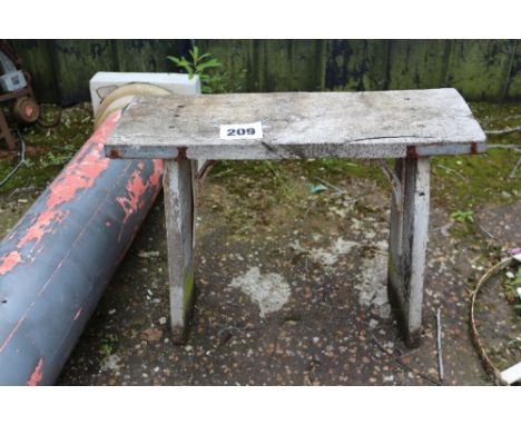 A wooden and metal bench