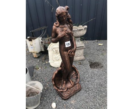 A pre-cast bronze effect garden ornament in the form of a female standing in a shell, approx. 124cm