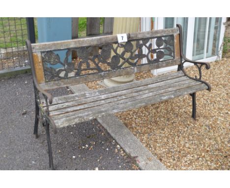 A timber and cast garden bench, width approx.&nbsp;126cm, AF