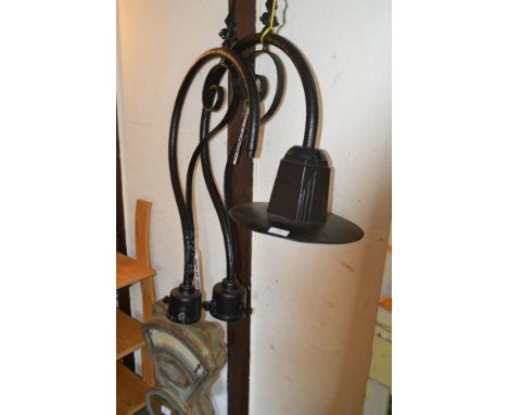 An iron Art Deco design street lamp and a part similar