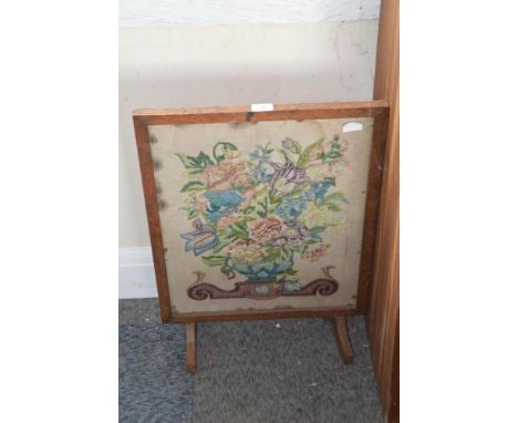 A needlework fire screen