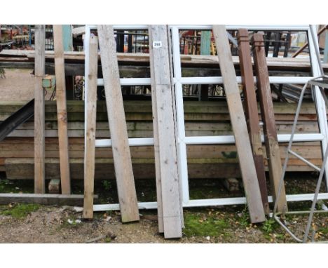 A rack with a large quantity of 9'x3' timber boarding&nbsp;and step ladder