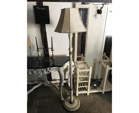 A painted standard lamp and shade