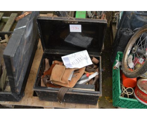 A metal toolbox and contents of tools together with a tool belt