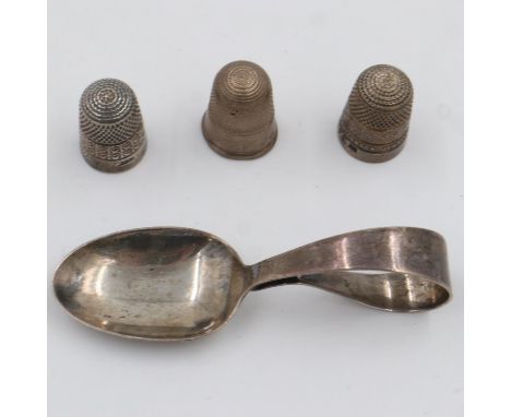 Three hallmarked silver thimbles including a James Walker example, and a hallmarked silver  caddy spoon, 35g. UK P&amp;P Grou