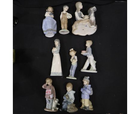 Nine Nao figurines, largest H: 23 cm, thumb broken to boy with cake, otherwise no chips or cracks. Not available for in-house