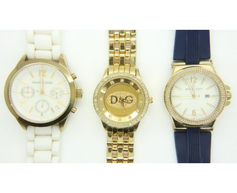 Two Michael Kors wristwatches and a D&amp;G example, all working at lotting up. UK P&amp;P Group 1 (£16+VAT for the first lot