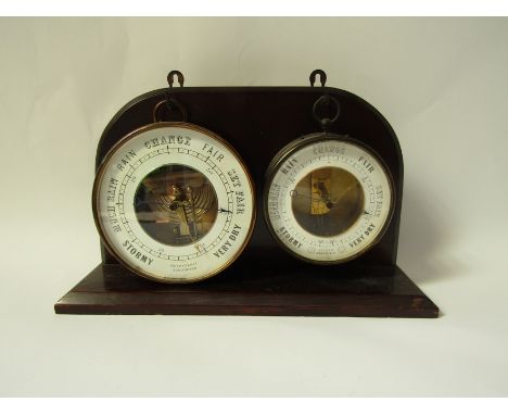 A Victorian brass-cased circular open dial "holosteric" aneroid barometer by Naudet stamped PNHB (Pertuis, Naudet, Hulot &amp