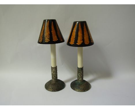 A pair of spring candle lamp sticks and shade holders together with a pair of 19thC fern decorated candleshades.