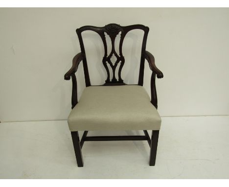 A 'Chippendale' mahogany elbowchair, the carved and interlaced back splat combining a gothic lancet shape with rococo ribands