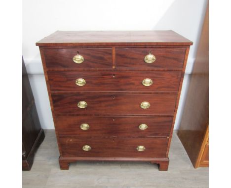 A late Georgian tall mahogany split chest  of two short over four graduated drawers on bracket feet. Height 130cm Width 109cm