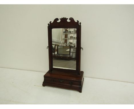 A George II mahogany dressing table mirror the rectangular plate with moulded frame surmounted by the original cresting, with