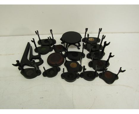 A collection of oriental hardwood vase, plate and cup &amp; saucer stands (16) 