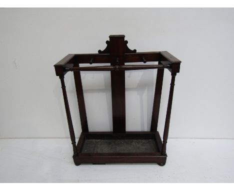 An early 19th century mahogany whip and stick stand with drip tray.  Height 96cm Width 72cm Depth 32cm.