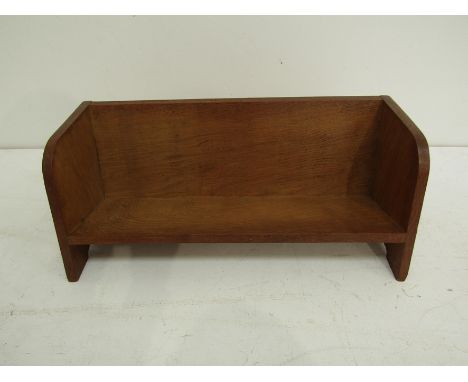 An early 20th century oak book trough. 22cm high x 58cm wide x 23cm deep