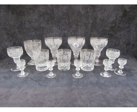 Three cut goblets etched with fruiting vines, a rummer with square lemon squeezer base, three tumblers, eight wine and five l