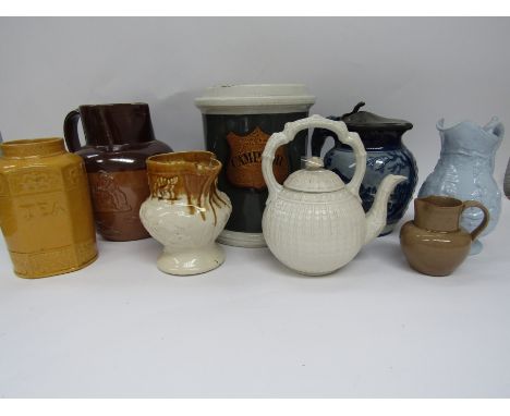 A large blue glazed drug jar with a gilded label lettered "Camphor" (No lid), a Doulton Lambeth stoneware hunting jug with sp