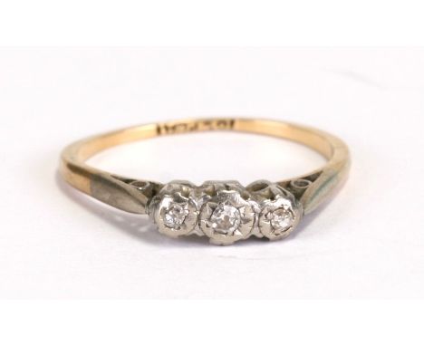 An 18ct gold and platinum three-stone diamond ring, approx UK size 'K'.