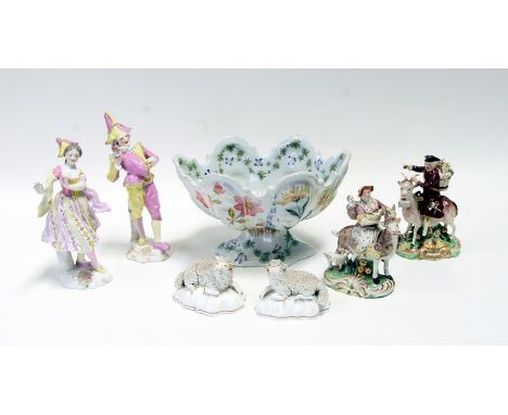 A 19th century pottery Welsh Tailor &amp; his Wife, 15cms (6ins) high; together with a pair of continental porcelain figures 