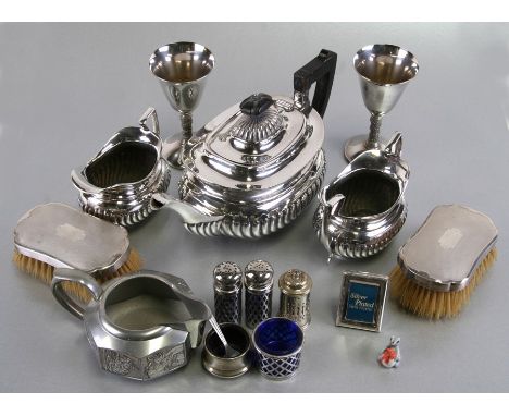 A quantity of silver and sliver plated items to include a pair of silver backed hair brushes, Birmingham 1934; a silver plate