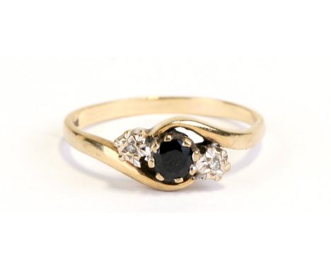 A 9ct gold and sapphire cross-over dress ring, approx UK size 'R'.Condition Reportgeneral wear, shank is a little worn