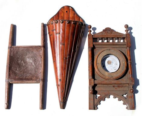 A faux bamboo hanging wall pocket, 68cms (28.75ins) high; together with a carved oak barometer frame, 52cms (20.5ins) high; a