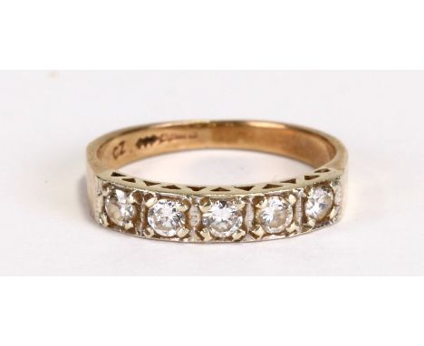 A 9ct gold and six-white stone half-hoop ring, approx UK size 'K'.