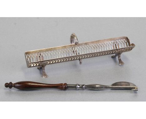 A George III style sterling silver pen trough with scroll handle, pierced decoration and shell capped hoof feet, weight 43g, 