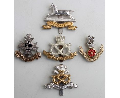 Five Military cap badges: The Loyal Regiment, The North Staffordshire Regiment, The South Staffordshire Regiment, The Sherwoo
