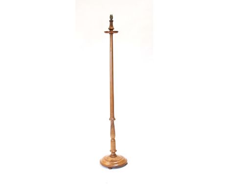 A turned walnut standard lamp.