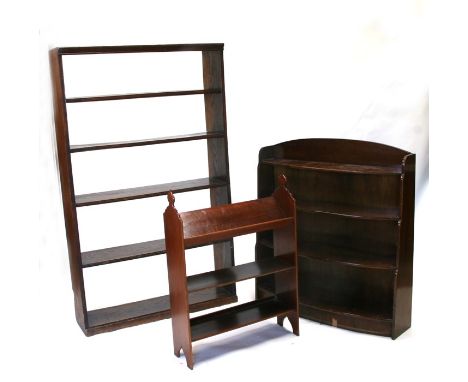 An oak open bookcase; together with another similar smaller; and a stained pine book trough, the largest 92cms (36ins) wide (