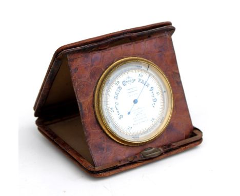 A Short &amp; Mason Travel Compensated barometer in a faux crocodile skin leather case, 10cms (4ins) wide.