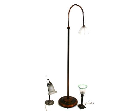A telescopic standard lamp with articulated ball joint and opaque glass shade; together with two similar table lamps (3).