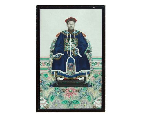 A late 19th / early 20th century Chinese printed and coloured ancestral portrait depicting a seated late Qing dynasty officia