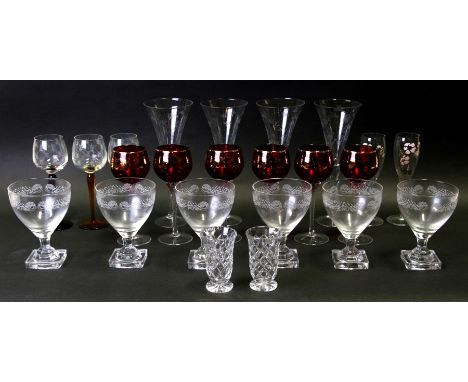 A set of six etched glasses with lemon squeezer bases; together with other glassware.