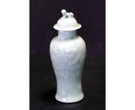 A Chinese celadon vase and cover of baluster form, the cover with dog of fo finial, 16cms (6.25ins) high.Condition ReportVery