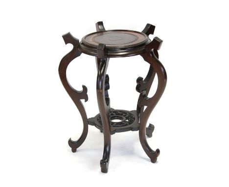 A Chinese vase plant stand of large proportions on scroll legs joined by a pierced under-tier, 52cms (20.5ins) diameter.