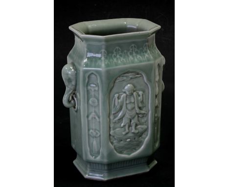 A Chinese rectangular bodied celadon glaze vase decorated with peasant figures and auspicious symbols, with elephant head han