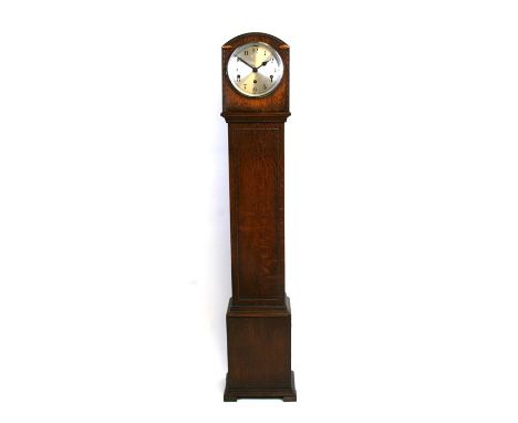 A 1930's dwarf longcase clock fitted with a three-train movement playing Westminster chimes, in an oak case, 127cms (50ins) h